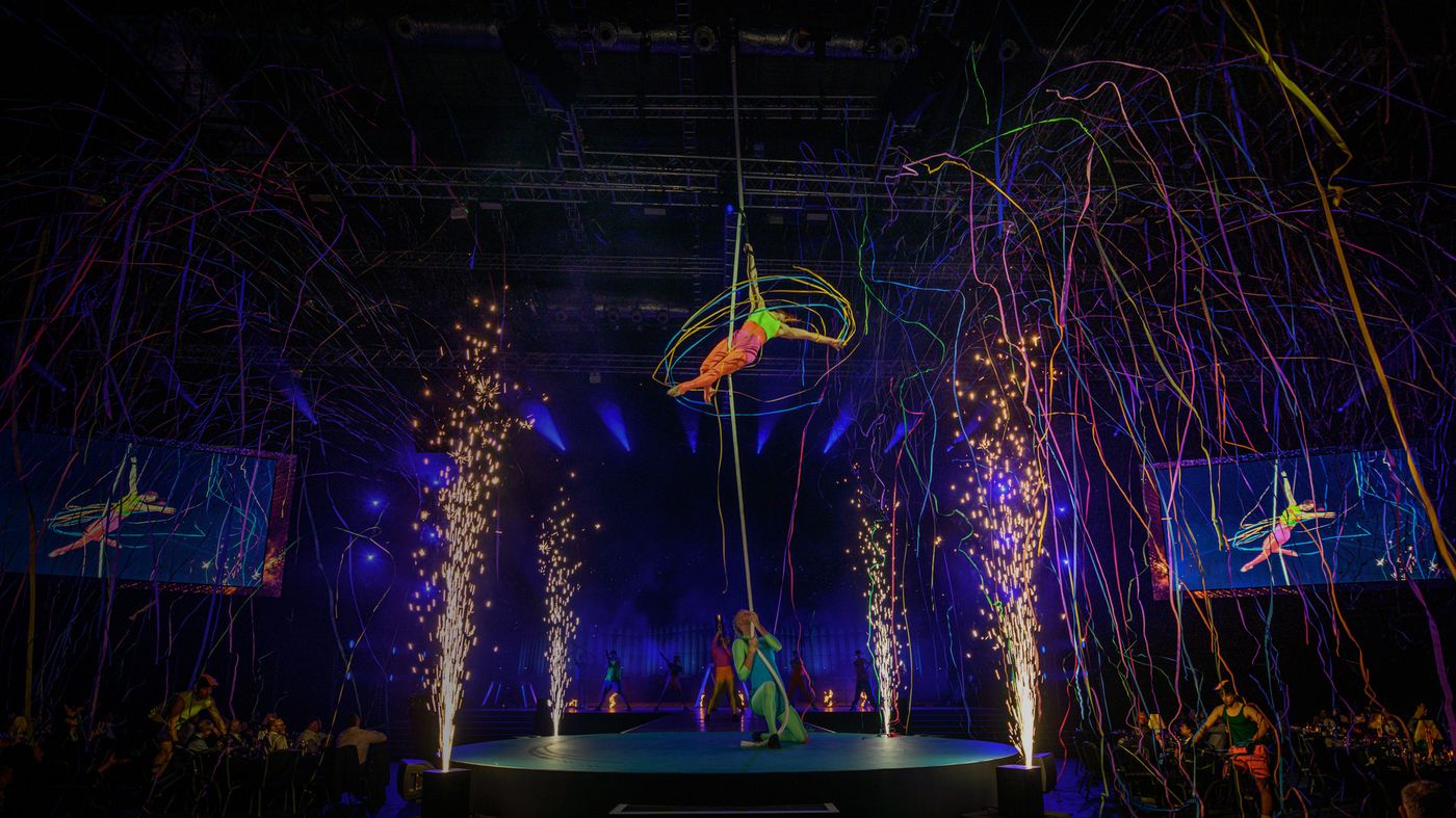 Colt Sales Connect 24 circus-style stage show with aerial performer